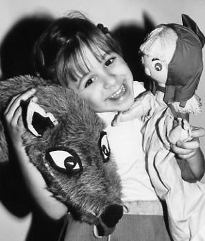 Child with Little Red Riding Hood puppets